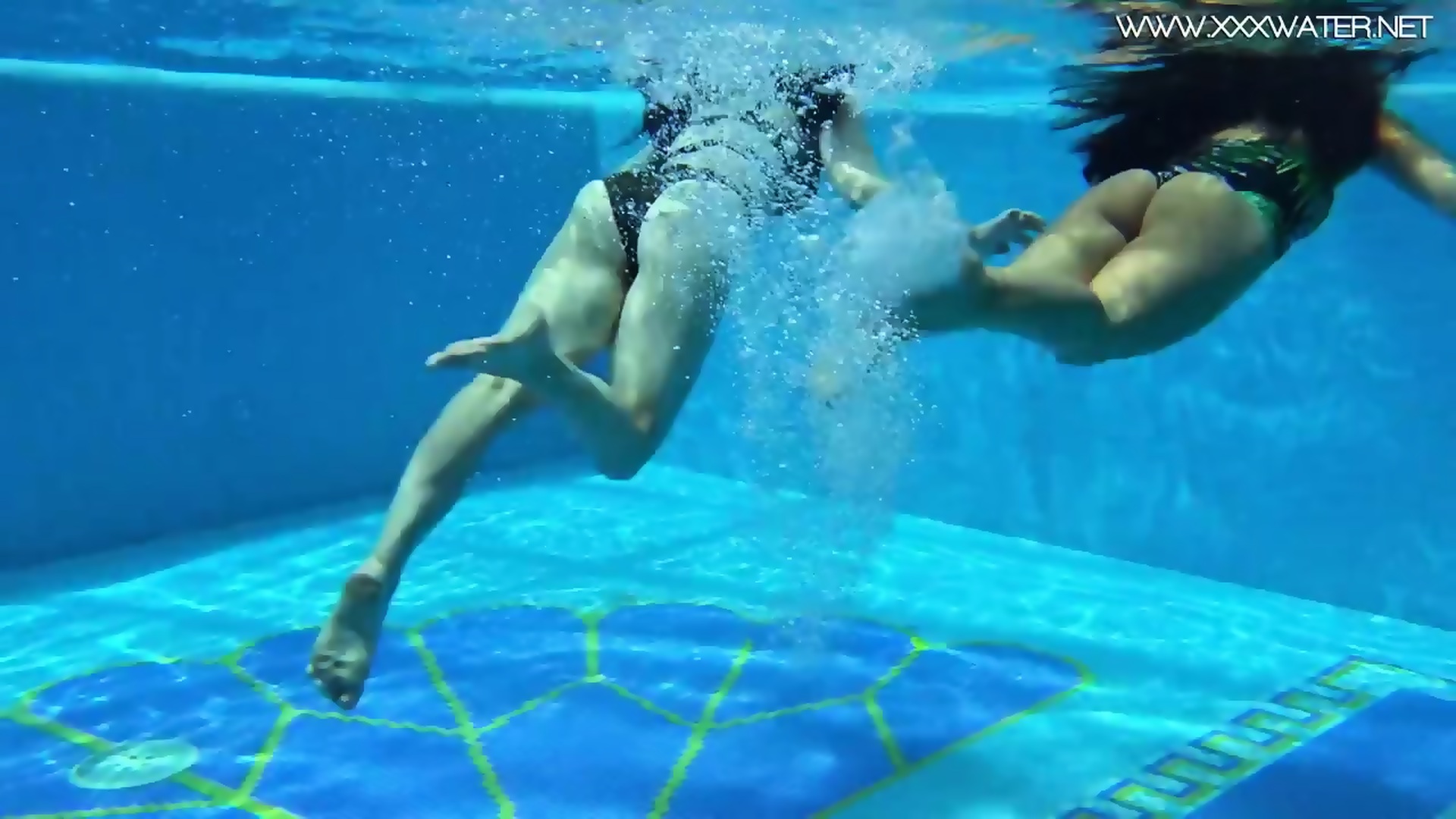 swimming nude underwater