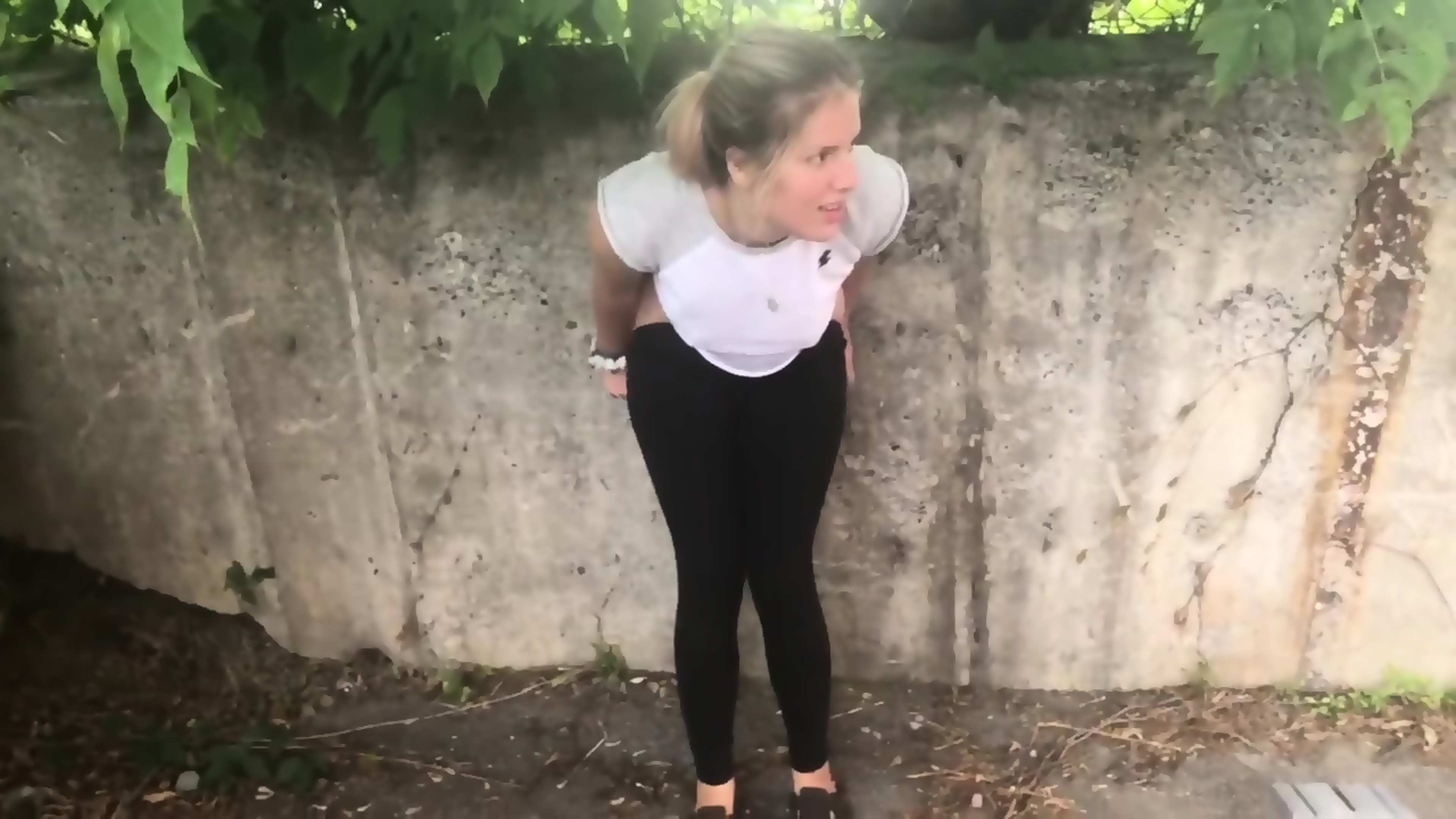 Teen Pees All Over Wall Outside In Tight Black Leggings